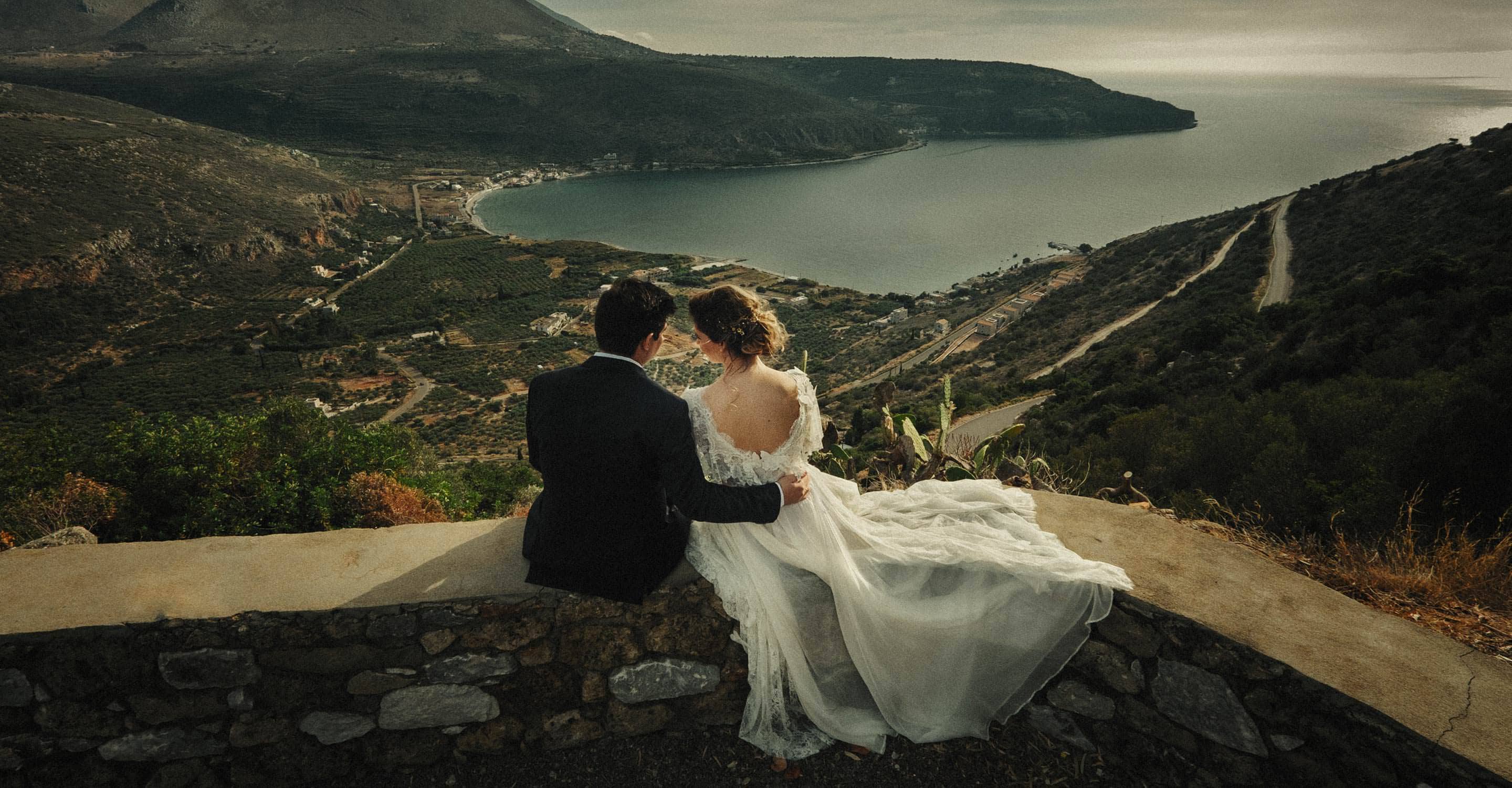 Wedding couple overlooking the Mani coastline in Greece