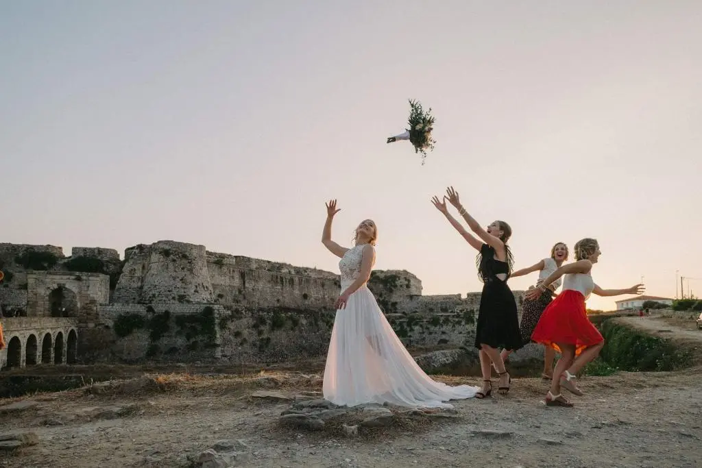 Bride and bridesmaids celebrating near Methoni Castle in Messinia