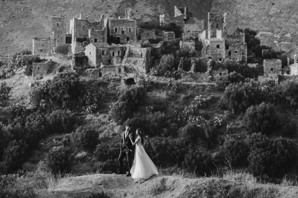 Bride and groom among the stone towers of Vathia, Mani