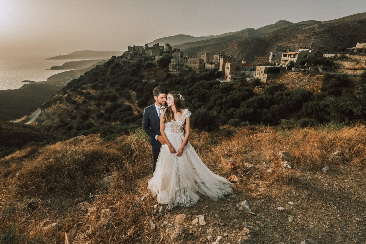 Wedding couple in the landscape of vathia ,Inner Mani, Greece