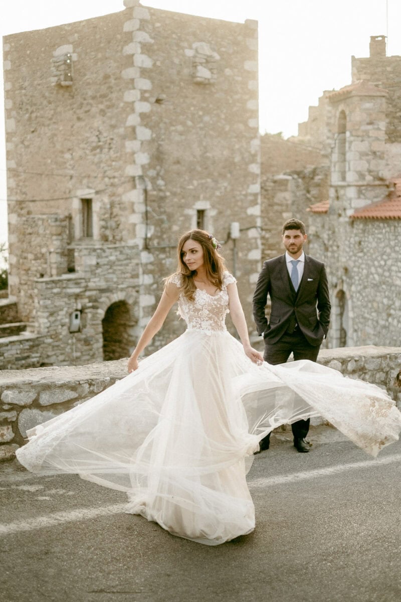 Bride and groom among the stone towers of Vathia, Mani