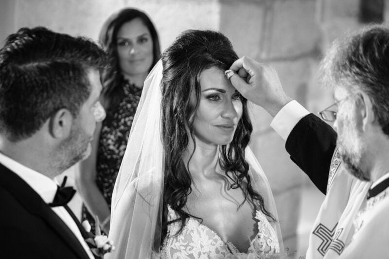 Bride during the wedding ceremony at the Church of the Transfiguration in Pylos