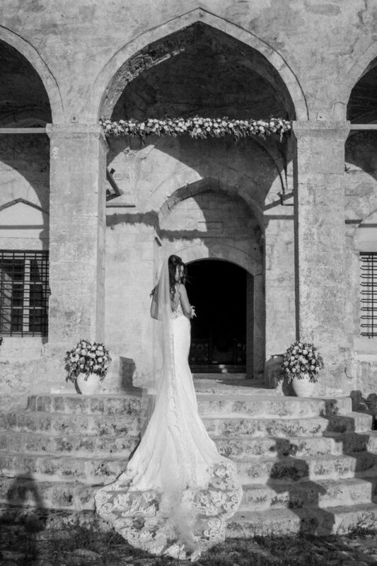 Bride outside the church at Niokastro after her wedding ceremony