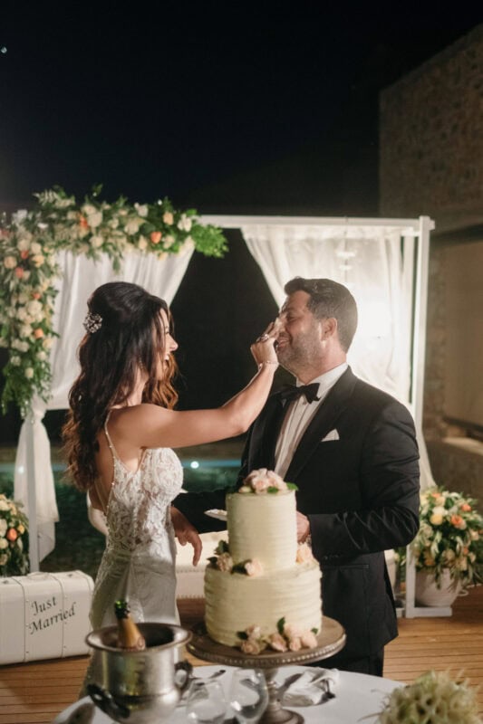 Charles and Miglena cutting their wedding cake at Costa Navarino