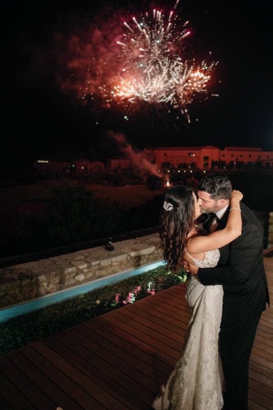 Bride and groom under fireworks at their Costa Navarino wedding