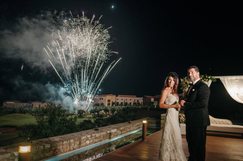 Charles and Miglena watching fireworks during their wedding celebration