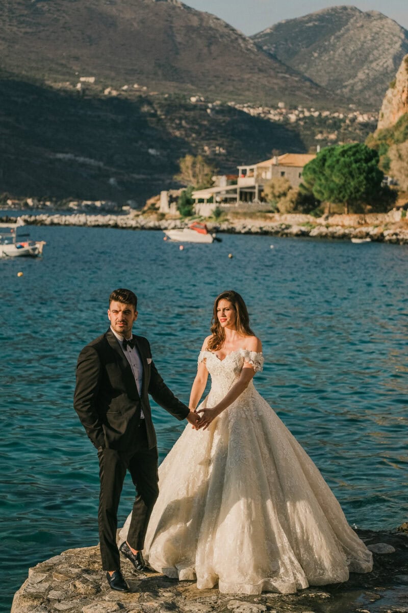 Bride and groom overlooking the Mani coastline in limeni
