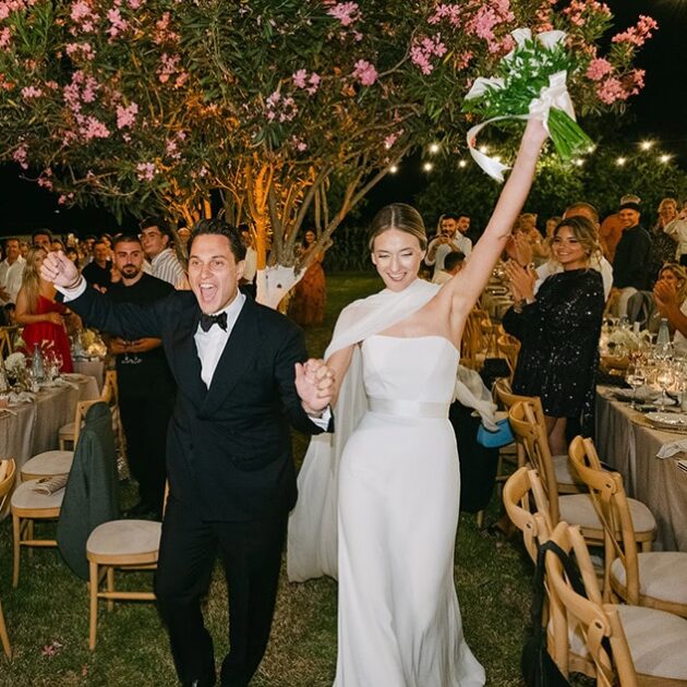 Couple-walking-through-the-family-estate.