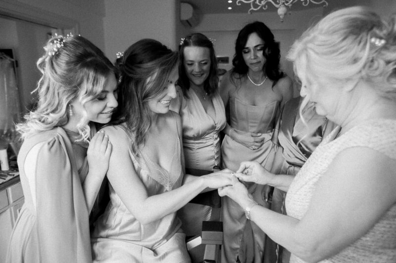 Bride getting ready with her family before the ceremony