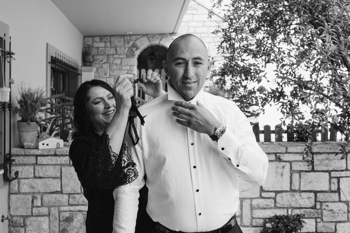 Groom getting ready for his wedding in Kalamata