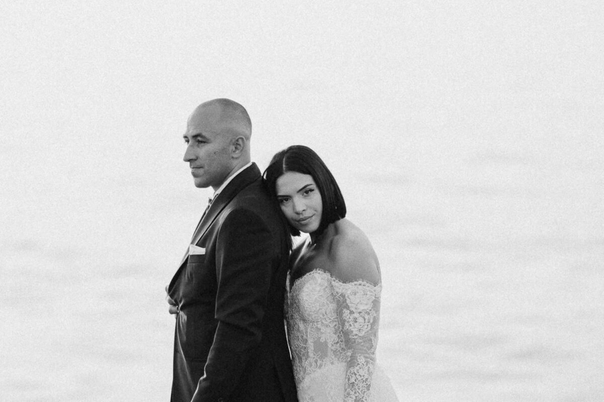 Newlywed couple by the sea after their Akrotiri Venue ceremony