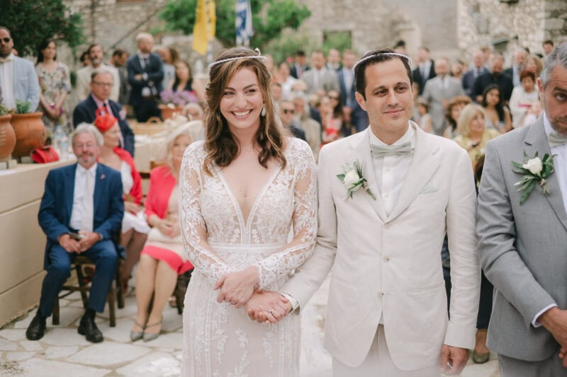 Bride and groom during their wedding ceremony in Mani Greece