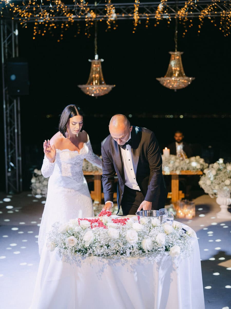 Wedding cake cutting during the evening reception Fireworks