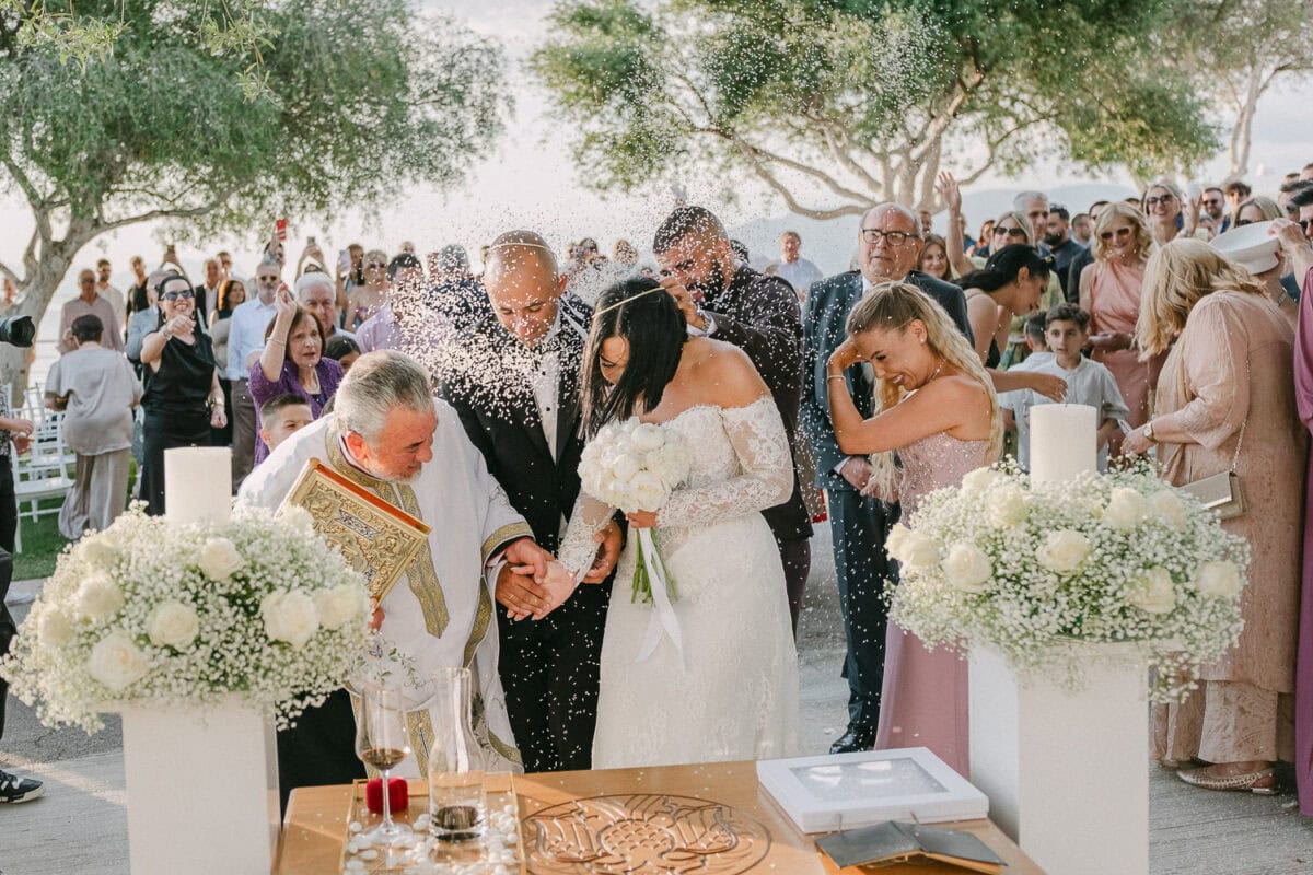 Newlyweds celebrating after their ceremony at Akrotiri Venue