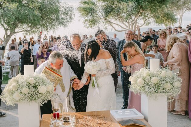 Newlyweds celebrating after their ceremony at Akrotiri Venue