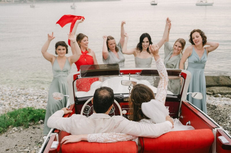 Bride and bridesmaids celebrating beside the sea in Mani